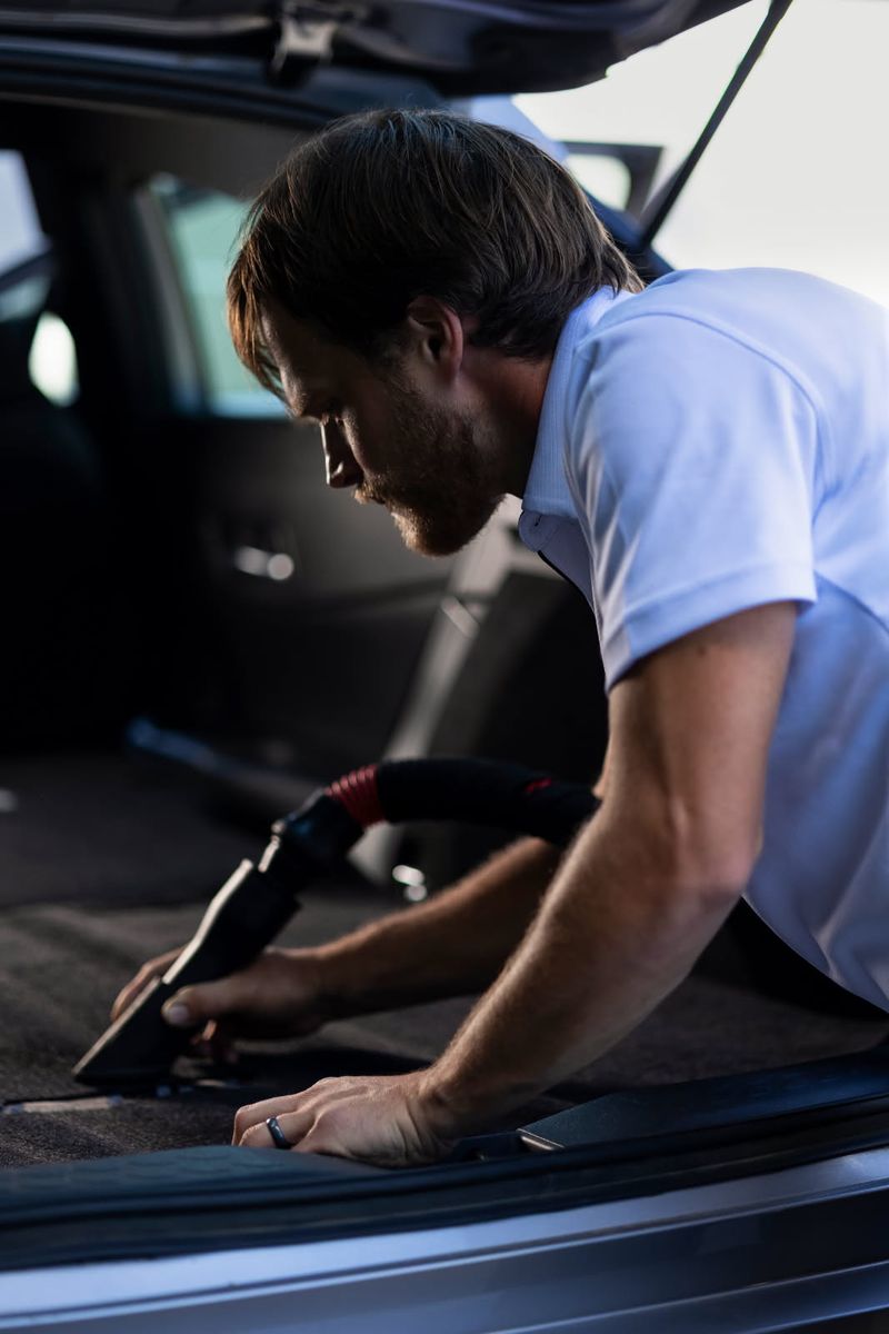 Vacuuming the trunk and carpets